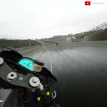Superbike Spins Out Helplessly on a Wet and Slippery Track
