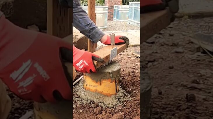 Deck support post concrete footings with post brackets. #construction #diy #concrete